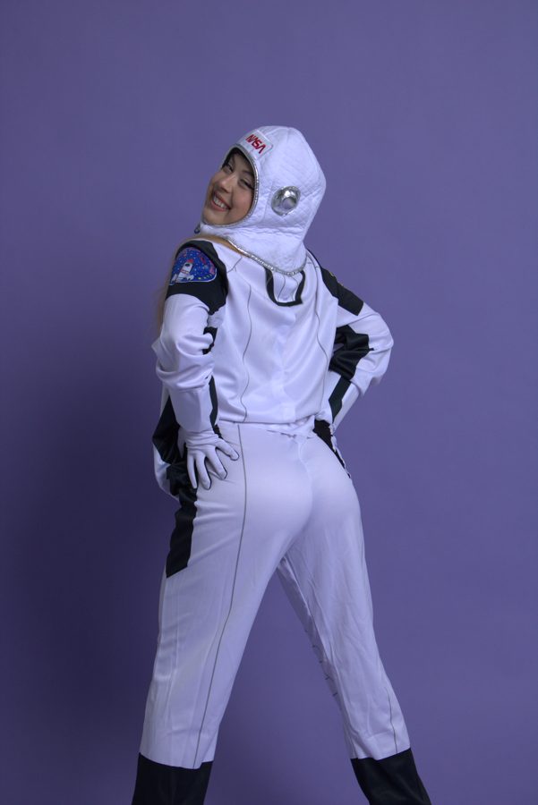 Astronaut costume on a purple backdrop